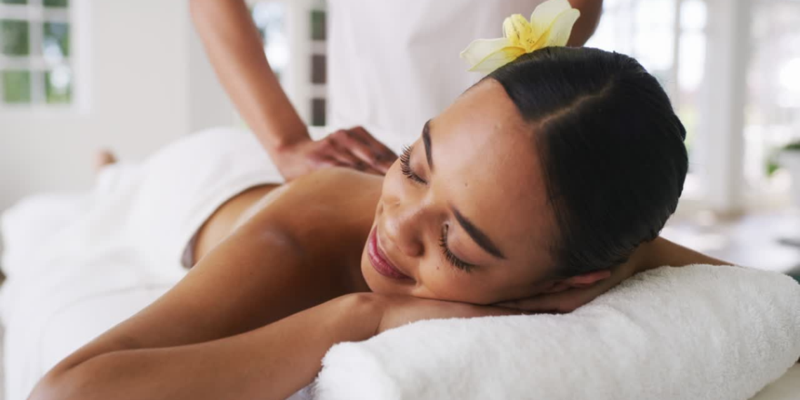 a black lady getting a back massage 1200 x 630 px