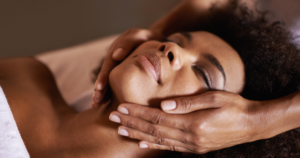 a black woman getting a facial.